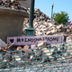 People walk past a building that was reduced to rubble after being burned during recent rioting following the shooting of Jacob Blake on August 28, 2020, in Kenosha, Wis. Blake remains in the hospital after being shot seven times in the back in front of his three children by a police officer.